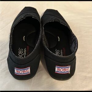 Skechers BOBS women’s Black Slip-On Slippers